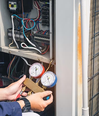 HVAC System Repair with Gauge